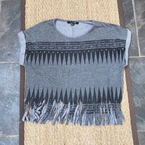 Gray top with fringe bottom.